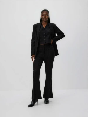 Reserved - Spodnie flare w paski - czarny