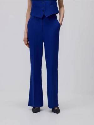 Reserved - Spodnie flare z kantem - niebieski