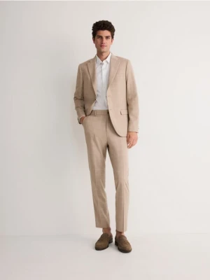 Reserved - Spodnie garniturowe slim fit - beżowy