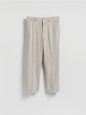 Reserved - Spodnie slim fit w kratę - beżowy