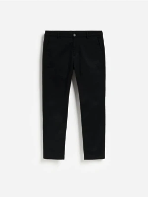 Reserved - Spodnie slim fit z mikrowzorem - czarny