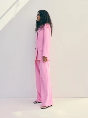 Reserved - Spodnie z kantem - intensywny róż