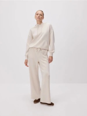 Reserved - Spodnie z szeroką nogawką - beżowy