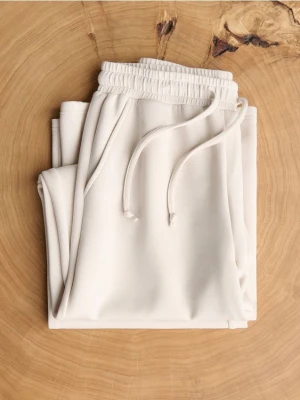 Reserved - Spodnie z szeroką nogawką - beżowy