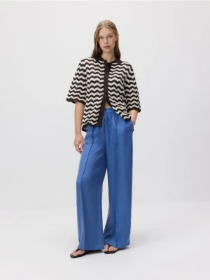 Reserved - Spodnie z tkaniną cupro - jasnoniebieski