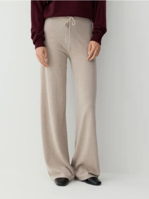 Reserved - Spodnie z wełny merino - beżowy