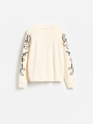 Reserved - Sweter z ozdobną aplikacją - kremowy