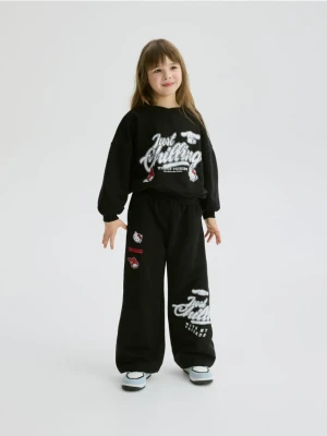 Reserved - Szerokie spodnie dresowe Hello Kitty - czarny