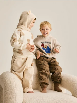 Reserved - Sztruksowe spodnie z aplikacją - kremowy