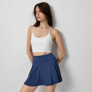 Rozkloszowana granatowa spódniczka mini ze wszytymi spodenkami House