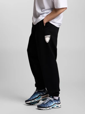 Shield Splash spodnie dresowe oversize męskie bawełniane czarne Klasyk