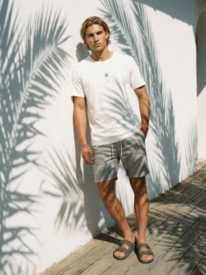 Sinsay - Bawełniana koszulka z nadrukiem wakacyjnym - kremowy