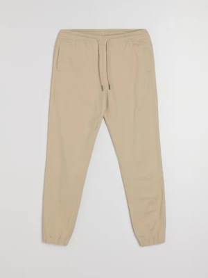 Sinsay - Bawełniane spodnie jogger - beżowy