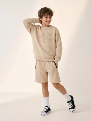 Sinsay - Bluza crewneck z napisem - beżowy