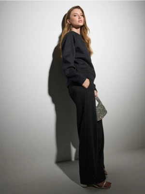 Sinsay - Dresowe spodnie z szeroką nogawką i brokatem - czarny