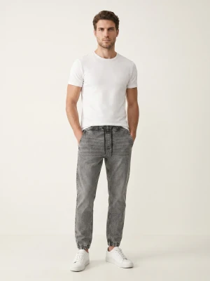 Sinsay - Jeansy jogger slim z efektem sprania - szary