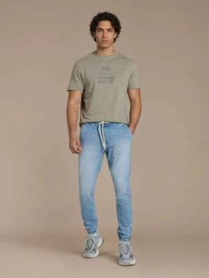 Sinsay - Jeansy jogger z efektem sprania - niebieski