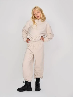 Sinsay - Polarowe spodnie ze ściągaczami - beżowy