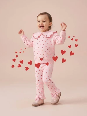 Sinsay - Prążkowane spodnie wide leg ze wzorem w serca - różowy