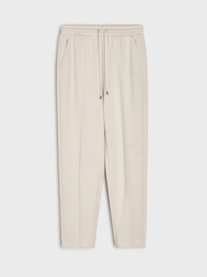 Sinsay - Spodnie cygaretki z dzianiny z wiskozą - kremowy