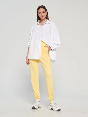 Sinsay - Spodnie dresowe basic - żółty