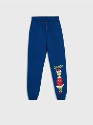 Sinsay - Spodnie dresowe jogger Grinch - niebieski