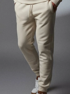 Sinsay - Spodnie dresowe jogger - kremowy