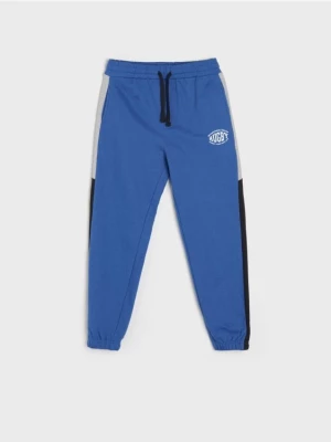 Sinsay - Spodnie dresowe jogger - niebieski