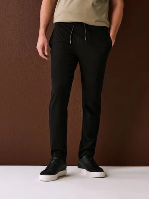 Sinsay - Spodnie dresowe jogger ottoman - czarny