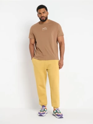Sinsay - Spodnie dresowe jogger - żółty