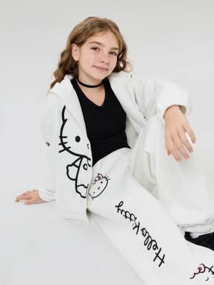 Sinsay - Spodnie dresowe oversize jogger z nadrukiem Hello Kitty - kremowy