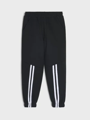 Sinsay - Spodnie dresowe z lampasami - czarny