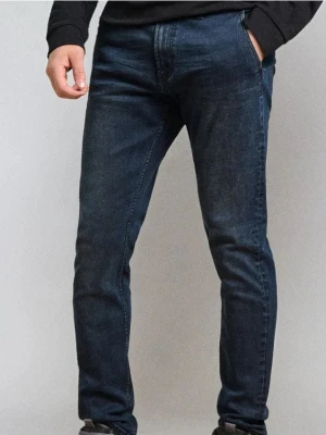 Sinsay - Spodnie jeansowe chino slim fit - niebieski