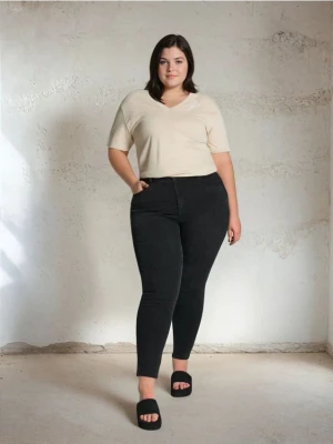Sinsay - Spodnie jeansowe skinny - czarny