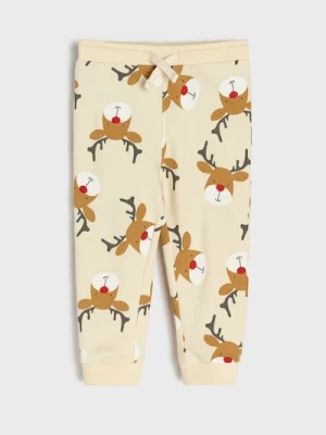 Sinsay - Spodnie jogger ze wzorkiem świątecznym - kremowy