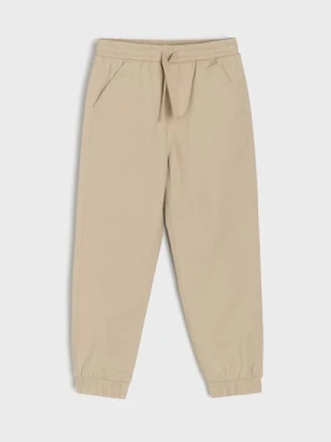Sinsay - Spodnie joggery slim z twillu o miękkim wykończeniu - beżowy
