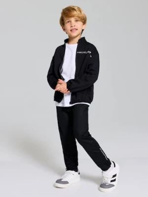 Sinsay - Spodnie sportowe slim fit z odblaskowymi elementami Active - granatowy