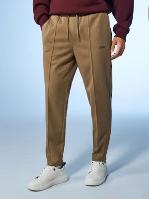 Sinsay - Spodnie tapered fit - beżowy