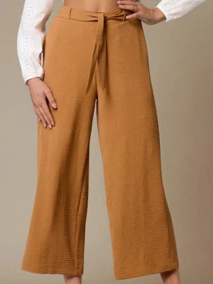 Sinsay - Spodnie wide leg z wiązaniem - żółty