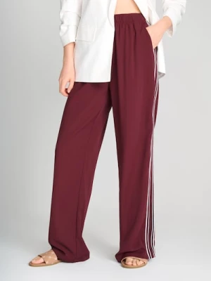 Sinsay - Spodnie z lampasami i zamkiem na dole nogawki - bordowy