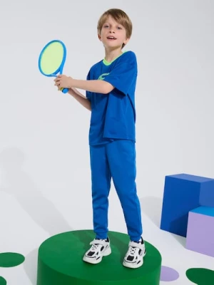 Sinsay - Spodnie z nadrukiem odblaskowym Active - niebieski