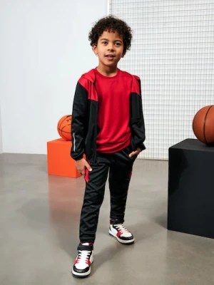 Sinsay - Sportowe spodnie z elementami odblaskowymi Active - czerwony