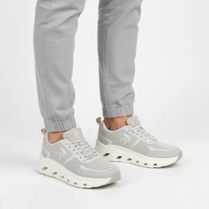 Sneakersy damskie Rieker, nowoczesna forma z lekkiej oddychającej cholewki zapewniająca wygodę amortyzowana podeszwa sportowy charakter, szare, W3504