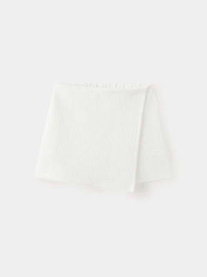 Spódnica z wbudowanymi spodenkami z dzianiny złamana biel - Dzieci - lata - MANGO KIDS