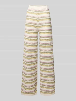 Spodnie bootcut we wzorze na całej powierzchni REVIEW