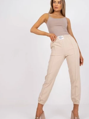 Spodnie damskie ze ściągaczami beżowe Italy Moda