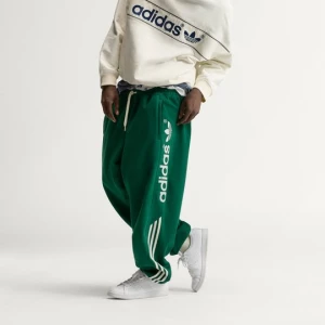 Spodnie dresowe adiSignature NY Adidas Dark Green