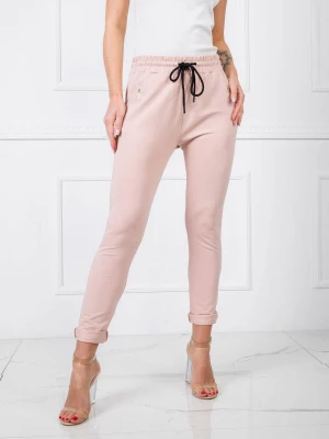 Spodnie dresowe jasny różowy sportowy casual nogawka zwężana troczki wiązanie Merg