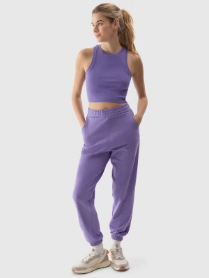 Spodnie dresowe joggery damskie - fioletowe 4F