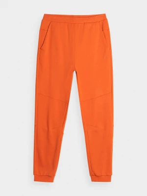 Spodnie dresowe joggery męskie - pomarańczowe 4F